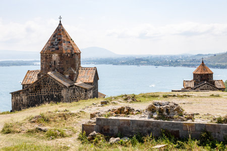 view of churches in Sevanavank Sevan Monastery, Armenia on sunny summer day on top of Sevan Peninsulaの写真素材