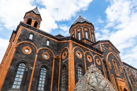 back side of Holy Saviour's Church and top of former church dome that collapsed during earthquake in Gyumri city on cloudy summer dayの写真素材
