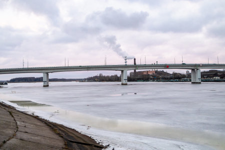 view of bridge across river near Ipatiev Monastery in Kostroma city in winter eveningの写真素材