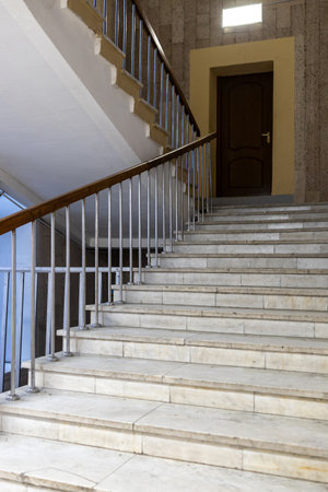marble stairs between floors in entrance of buildingの写真素材