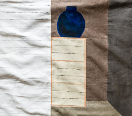 fragment of handcrafted textile panno with handpainted blue vase on stockの写真素材