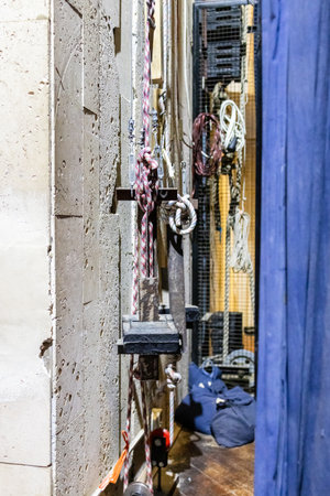 ropes and mechanisms for raising the curtain behind a theater stageの写真素材