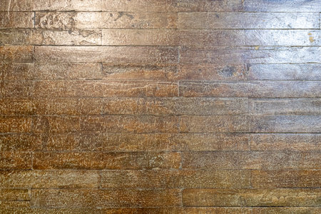 varnished wooden floor indoors house lit by electric lightの写真素材