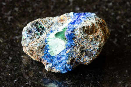 sample of rough azurite and malachite rock on black granite background close up from Russiaの写真素材
