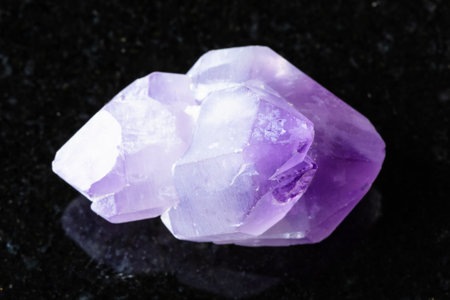 sample of rough amethyst crystals on black granite background close up from Madagascarの写真素材