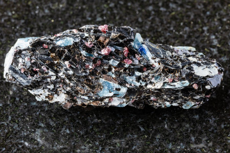 sample of rough kyanite in biotite rock on black granite background close up from Karelia, Russiaの写真素材