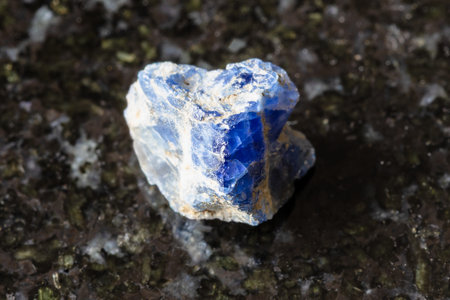 sample of rough benitoite rock on black granite background close up from USA, Californiaの写真素材