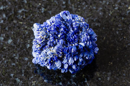 sample of rough crystalline azurite mineral on black granite background close up from Kazakhstanの写真素材