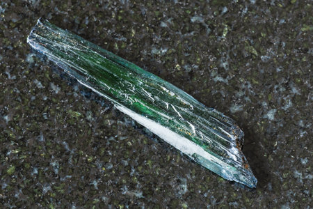 sample of rough vivianite crystal on black granite background close up from Brazilの写真素材