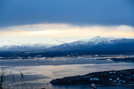 dusk over Avacha Bay near Petropavlovsk-Kamchatsky city from Mishennaya sopka in spring evening, Kamchatka Krai, Russiaの写真素材