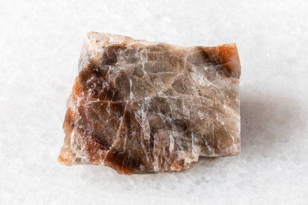 sample of raw nepheline rock on white marble background close upの写真素材