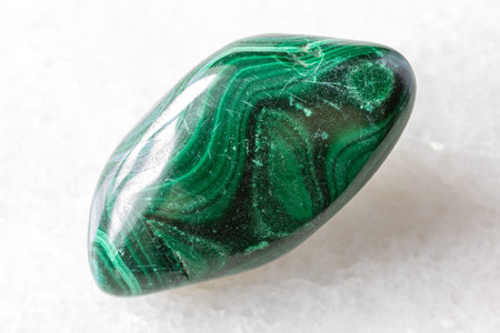 sample of tumbled malachite mineral close up