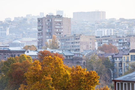 above view of houses in Kentron district of Yerevan city in smoggy autumn morningの写真素材