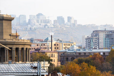 above view of apartment houses in Yerevan city in smoggy autumn morningの写真素材