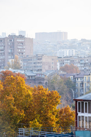 view of houses in Kentron district of Yerevan city in smoggy autumn morningの写真素材