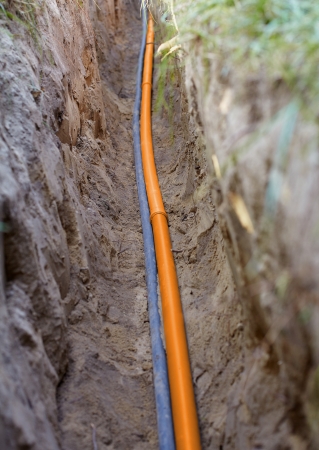 Laying sewer pipes and electrical cablesの写真素材