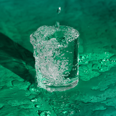 Splashing water from glassの写真素材