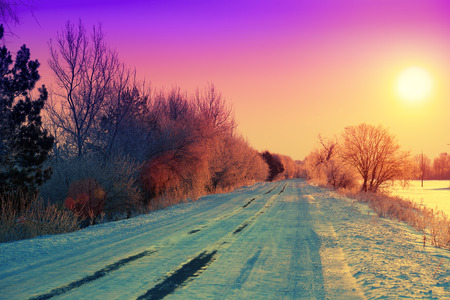 Beautiful winter sunrise over roadの写真素材