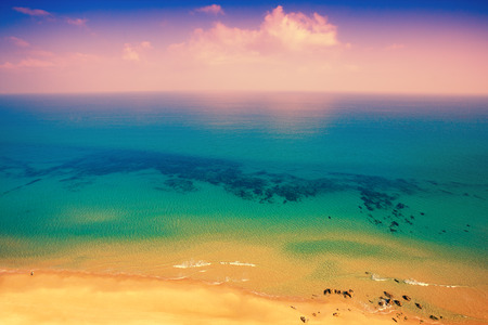 Pink sunrise over sea, top viewの写真素材