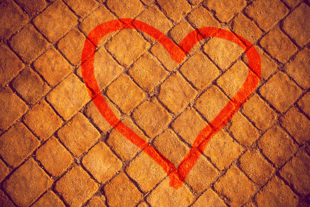 Heart painted on a stone wall, grunge の写真素材