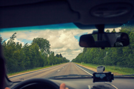 Driving a car on asphalt road