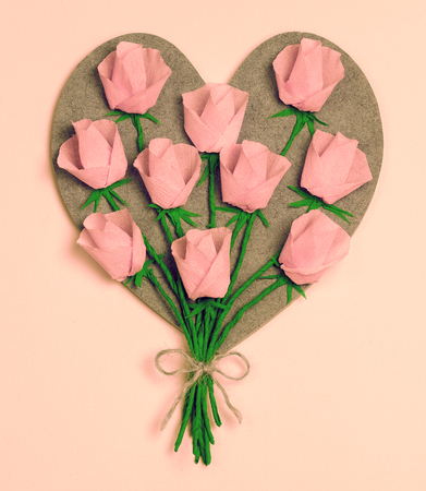 Vintage handmade wooden heart decorated with paper rosesの写真素材