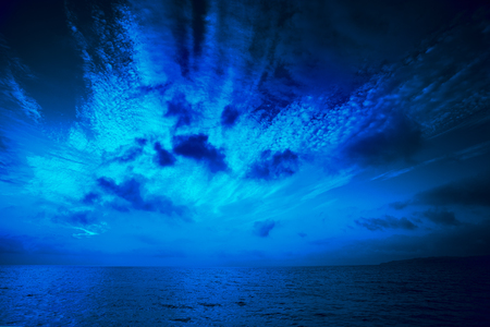 Early morning, sunrise over sea. Blue coloredの写真素材