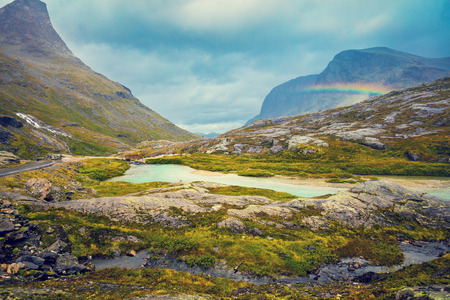 Mountain landscape. Rocky shore of mountain lake in rainy autumn morning. Beautiful nature Norway.の写真素材
