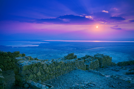 Beautiful sunrise over Masada fortress. Ruins of King Herod's palace in Judaean Desert.の写真素材