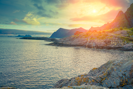 Rocky seashore with cloudy sky at sunset. Beautiful nature of Norway. Lofoten islands. Reineの写真素材