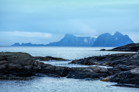 Rocky seashore with cloudy sky. Wilderness. Beautiful nature Norway. Lofoten islandsの写真素材
