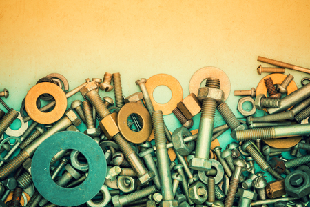 Abstract grunge metallic background from bolts, screws, nutsの写真素材