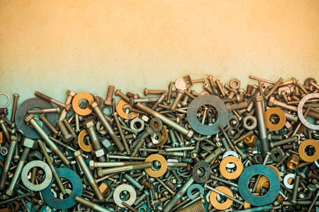 Abstract grunge metallic background from bolts, screws, nutsの写真素材
