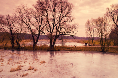 Frozen lake in winter. Brown coloredの写真素材