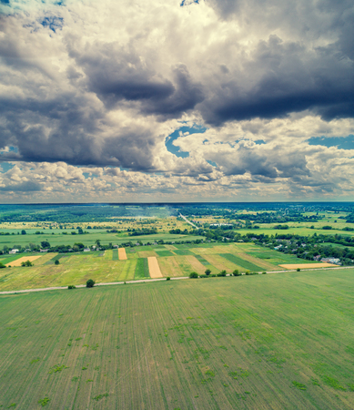 Aerial view of the rural landscape. Countrysides with dramatic cloudy skyの写真素材