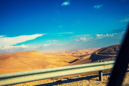 Driving a car on mountain road. View at beautiful mountain landscape from the car window. Israel