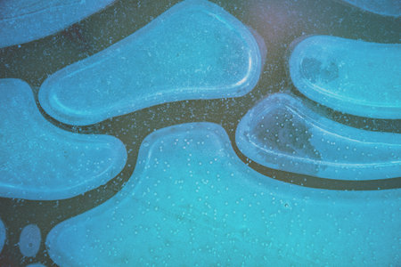 Natural abstract pattern on a frozen puddle. Nature background
