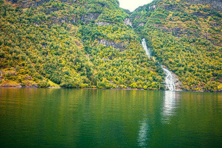 Mountain landscape with lake. Beautiful nature of Norway. Geiranger fjord. Waterfallの写真素材