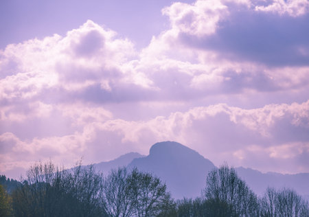 Silhouette of a mountain range against the background of a beautiful cloudy sky
