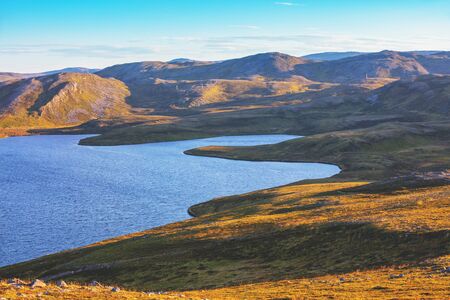 Beautiful lake at sunset. Wild nature Norway.  Nordkapp, Mageroya island.の写真素材