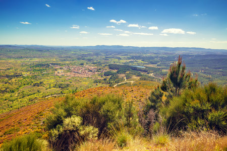 Panoramic landscape, view of valley, village in valley, mountains and fiels. Mountain landscape in...