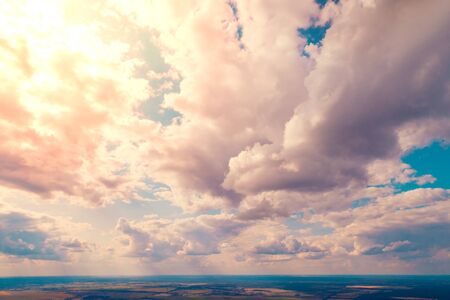Colorful cloudy sky at sunset. Aerial view. Sky texture, abstract nature backgroundの写真素材