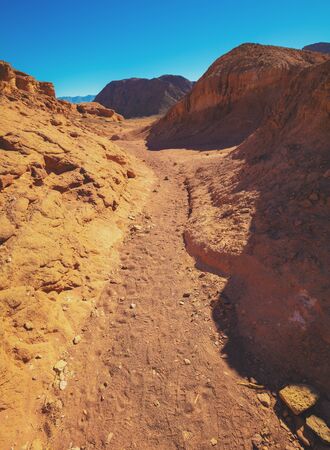 Desert nature landscape. Sandstone rocks. Dirt road in Timna Park, Israelの写真素材