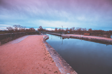 Digoin canal bridge. Boat canal bridge over Laura river in early spring. Digoin, France