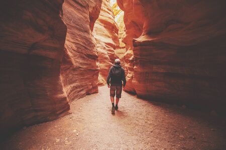 A man walking in canyon back to the camera. Red canyon, Eilat, Israelの写真素材