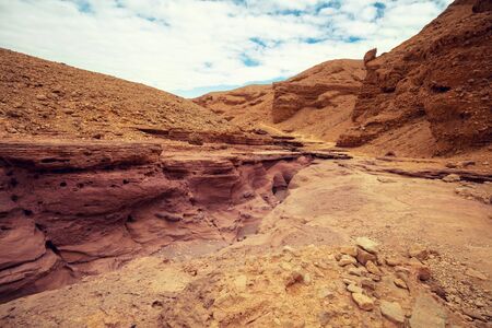 Dry riverbed. Desert nature landscape. Stone texture. Abstract natural sandstone background. Red Canyon, Eilat, Israelの写真素材