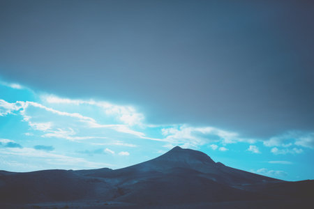 Mountainous desert with dramatic cloudy sky. Judean desert in Israel at sunset