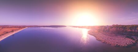 Magical sunset over the lake. Landscape panorama. View from above. Serene lake in the evening. Nature landscapeの写真素材