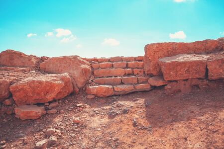 Ruins of an antic city in the desert against a blue skyの写真素材