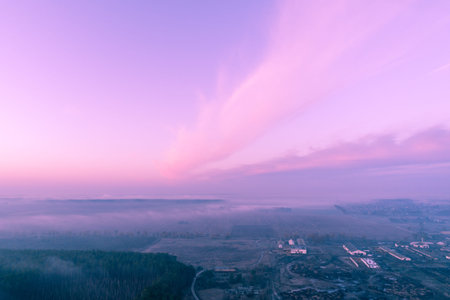 Early misty morning. Sunrise in countryside. Rural landscape in early spring. Aerial view